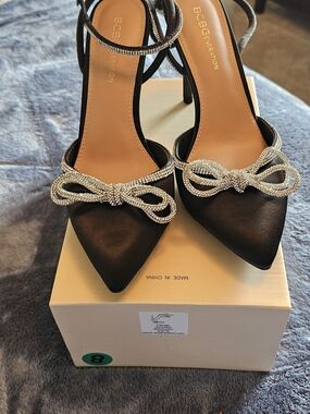 BCBGeneration Black Satin Pointed Toe Heels with Crystal Bow